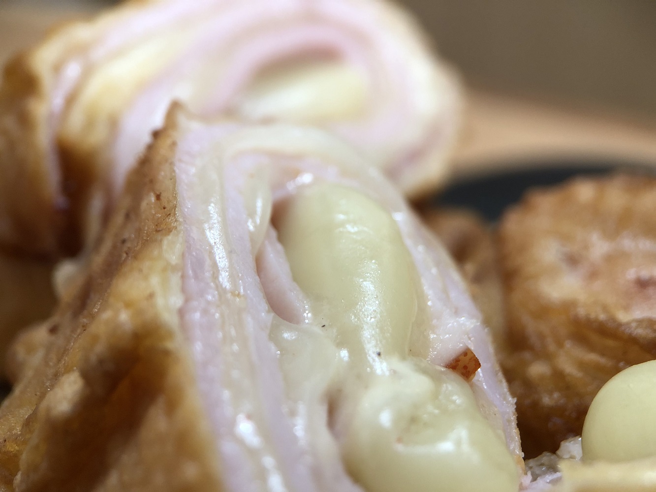 Cheesy ham rolls photographed with closeup