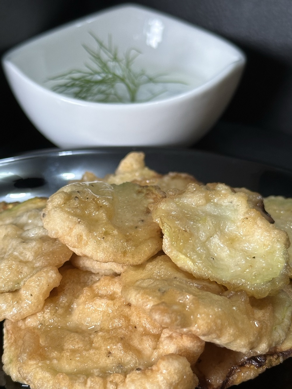 fried zucchini slices served with thyme yogurt