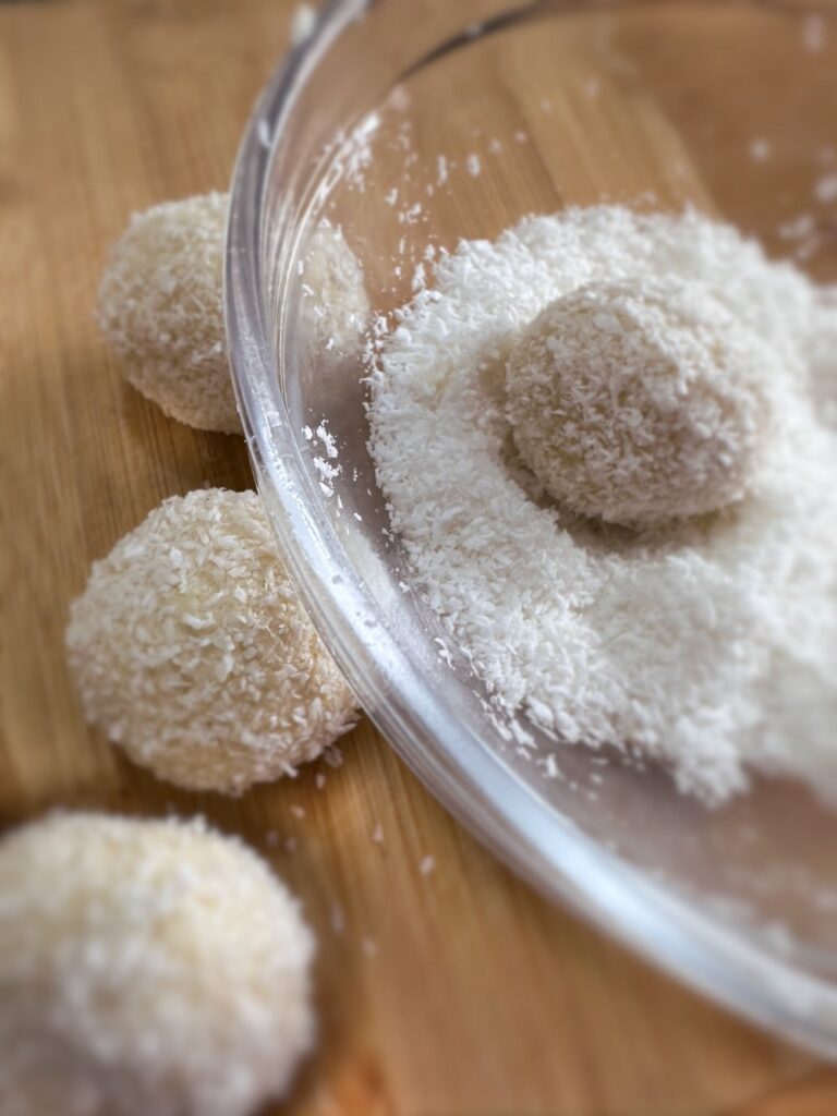 vanilla coconut balls in desiccated coconut