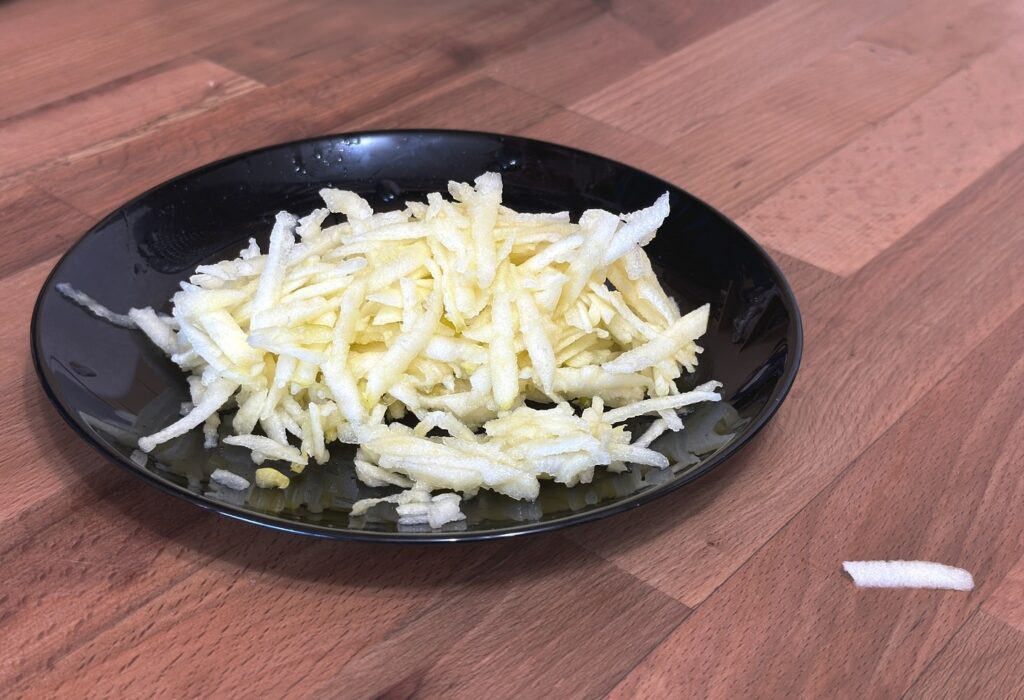 grated apple for an apple and biscuit dessert