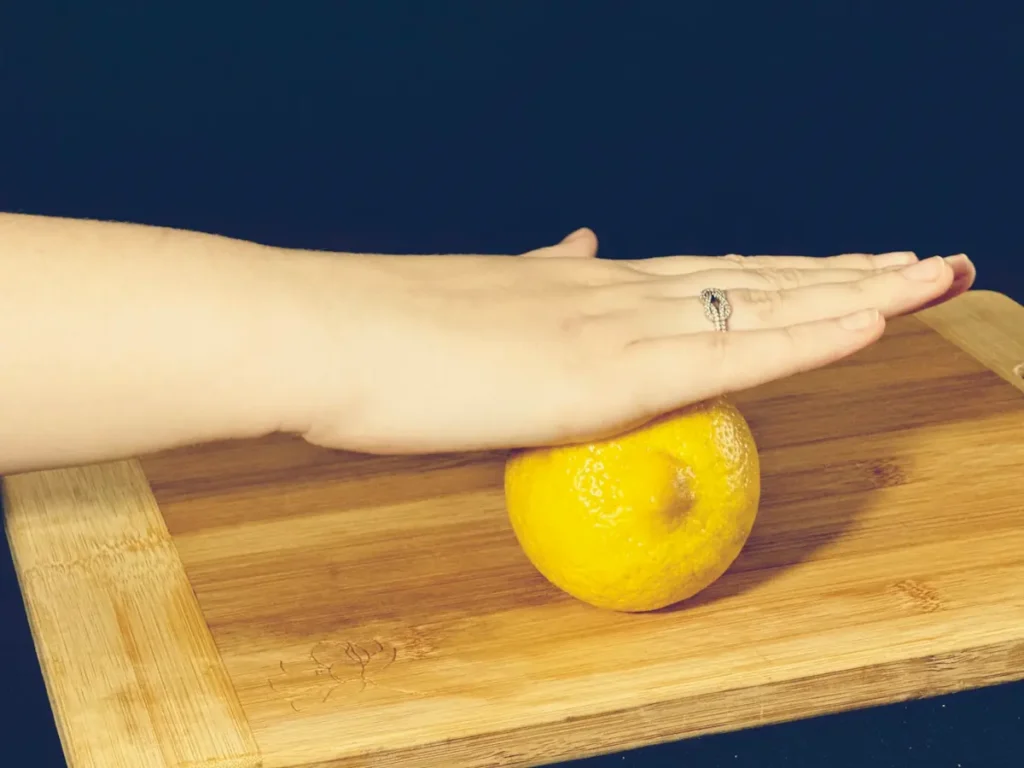 rolling the lemon for most lemon juice extracted