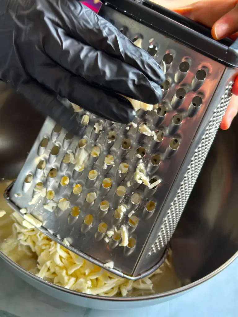 grater to prepare the cheese for the Cheese balls part 1 recipe